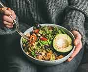 a person preparing to eat a healthy meal